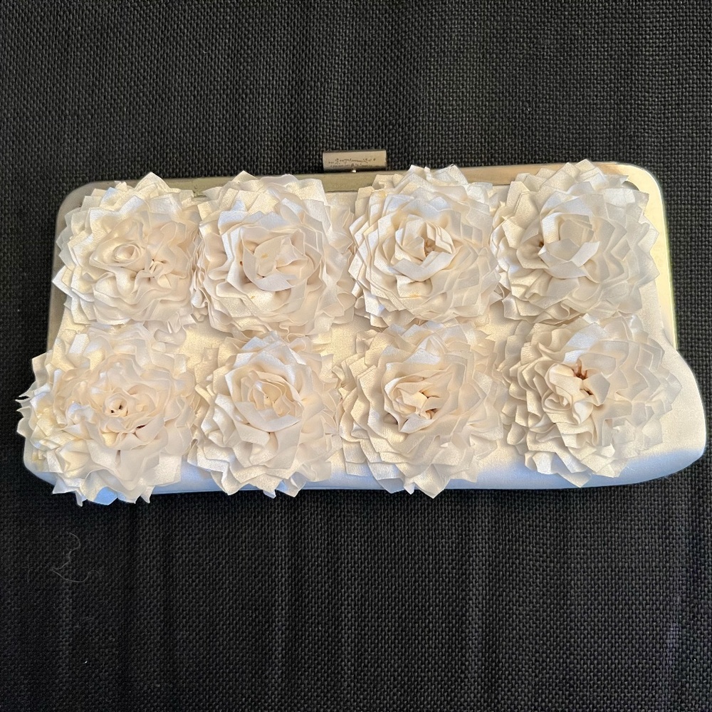 Arnold Churgin (vintage/new). Off-white, floral appliqué design, satin clutch.